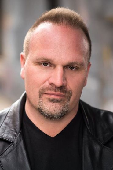 Том Скорцоне