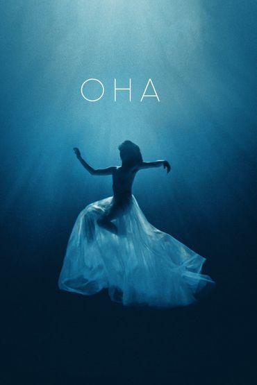 Она