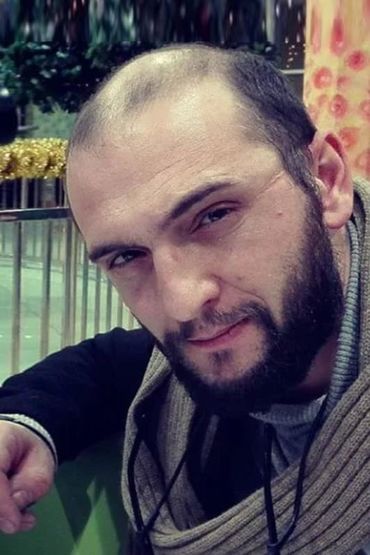 Теоман Хос